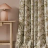 neutral botanical curtain with side table and lamps