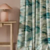 blue contemporary curtain with side table and lamps