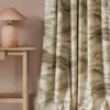 neutral contemporary curtain with side table and lamps