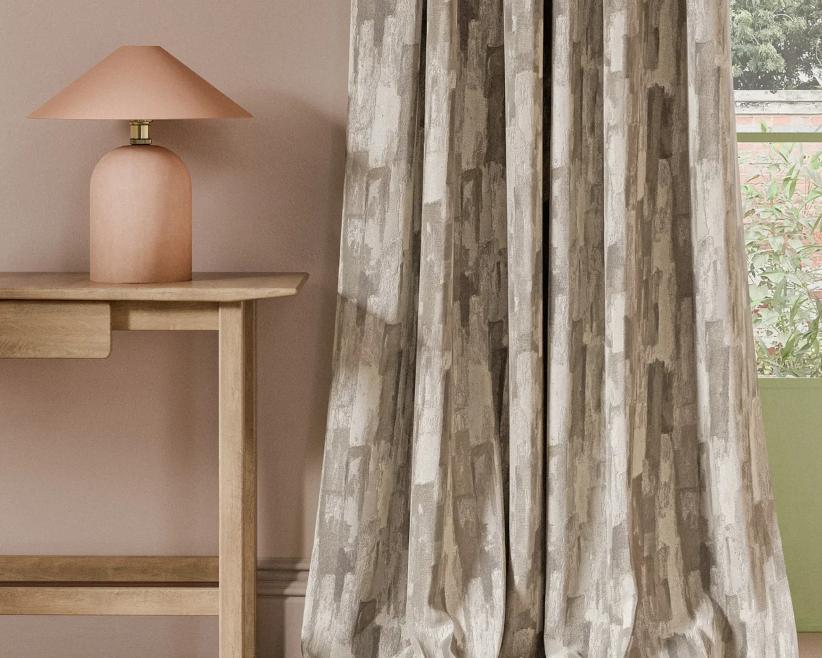 neutral contemporary curtain with side table and lamps