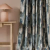 blue contemporary curtain with side table and lamps