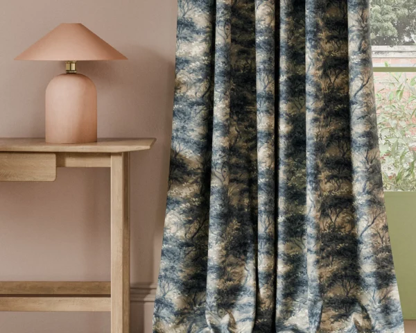 blue botanical curtain with side table and lamps