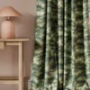 green botanical curtain with side table and lamps
