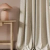 neutral contemporary curtain with side table and lamps