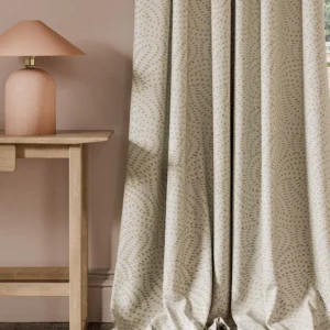 neutral contemporary curtain with side table and lamps