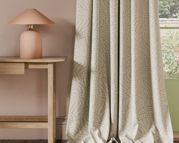 neutral contemporary curtain with side table and lamps
