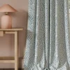 blue contemporary curtain with side table and lamps