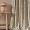 neutral botanical curtain with side table and lamps