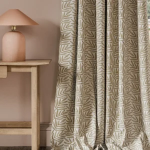neutral botanical curtain with side table and lamps
