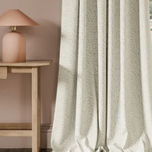 neutral botanical curtain with side table and lamps