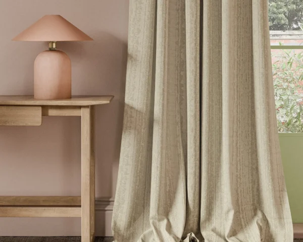 neutral striped curtain with side table and lamps