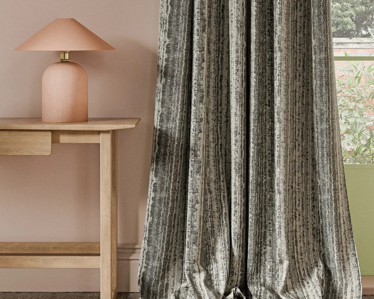black-grey striped curtain with side table and lamps