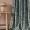 black-grey botanical curtain with side table and lamps