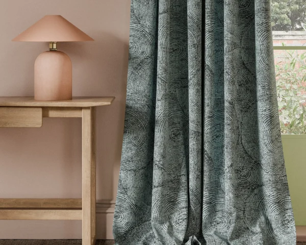 black-grey botanical curtain with side table and lamps