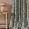 black-grey botanical curtain with side table and lamps