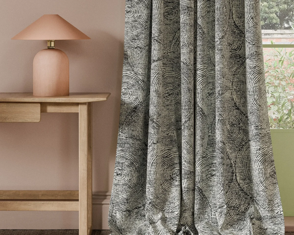 black-grey botanical curtain with side table and lamps