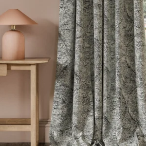 black-grey botanical curtain with side table and lamps