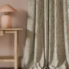 neutral botanical curtain with side table and lamps