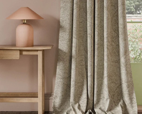 neutral botanical curtain with side table and lamps