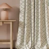 neutral contemporary curtain with side table and lamps