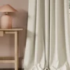 neutral contemporary curtain with side table and lamps