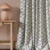 blue contemporary curtain with side table and lamps