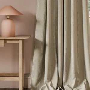 neutral striped curtain with side table and lamps