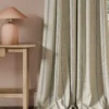 black-grey striped curtain with side table and lamps
