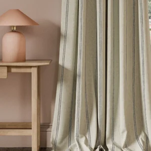 black-grey striped curtain with side table and lamps