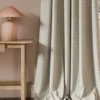 neutral geometric curtain with side table and lamps