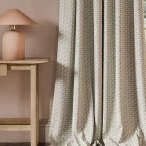 neutral geometric curtain with side table and lamps