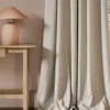 neutral geometric curtain with side table and lamps