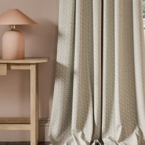 neutral geometric curtain with side table and lamps
