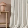 neutral geometric curtain with side table and lamps