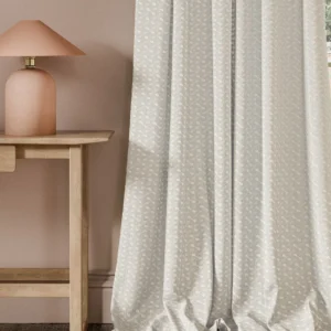 neutral geometric curtain with side table and lamps