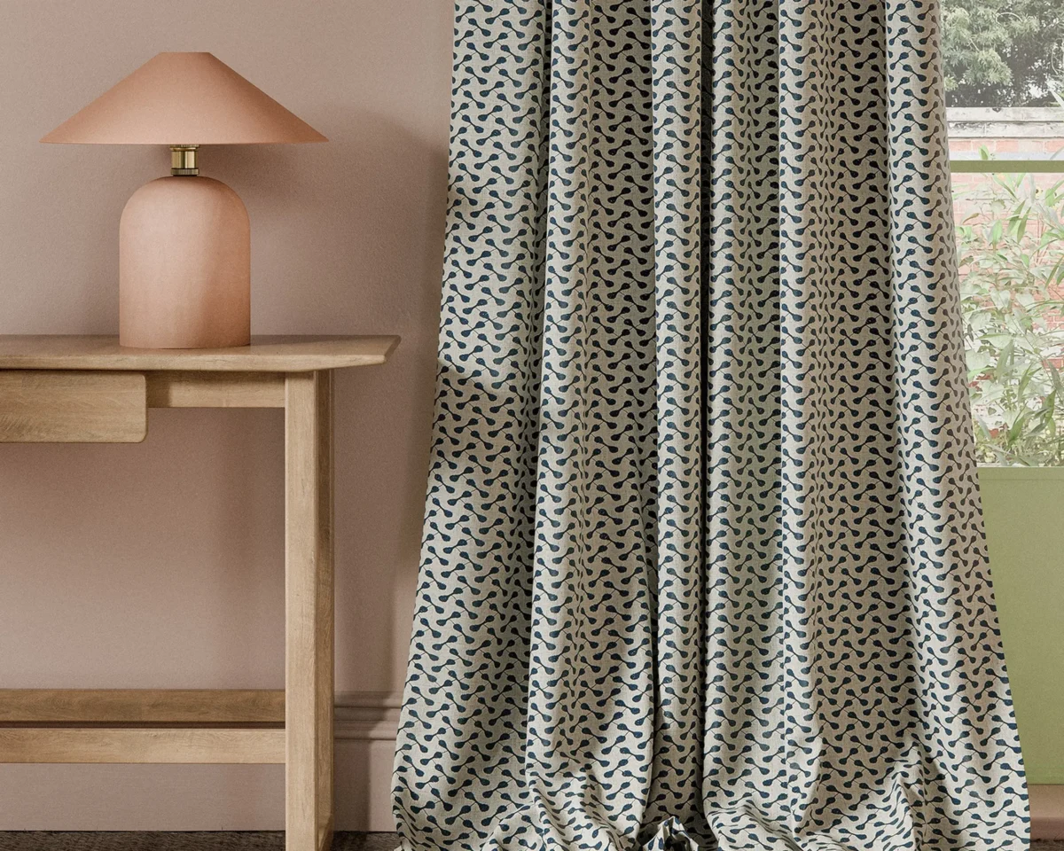 Necto Fabric - Ink by blue geometric curtain with side table and lamps