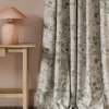 green misc curtain with side table and lamps