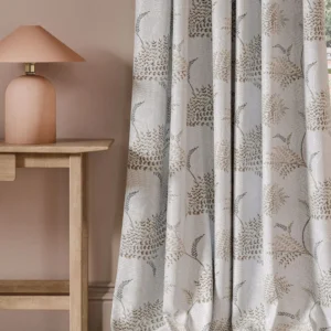 neutral botanical curtain with side table and lamps