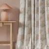 neutral geometric curtain with side table and lamps
