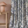 blue misc curtain with side table and lamps