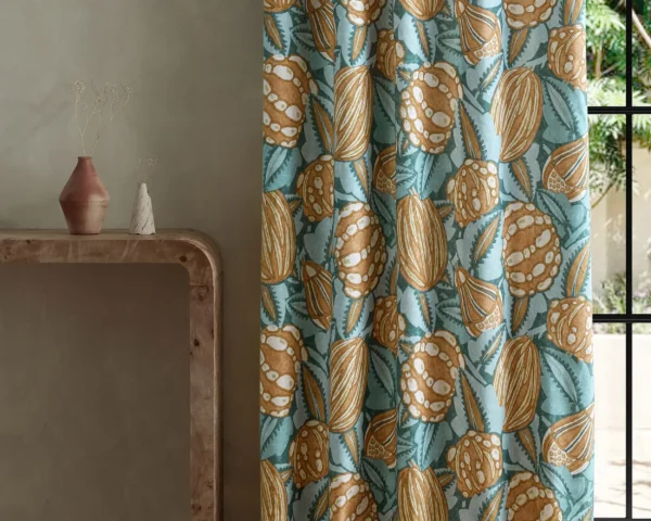blue botanical curtain with side table and vases