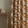 brown botanical curtain with side table and vases