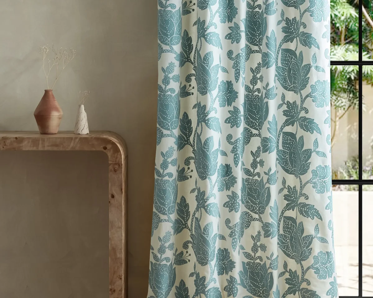 Zamora Fabric - Azul by blue botanical curtain with side table and vases