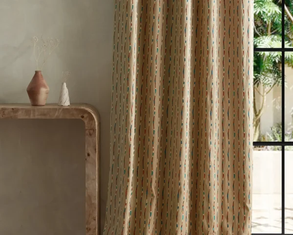 Morelia Fabric - Terracotta / Cerulean by multicolour striped curtain with side table and vases