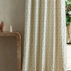 green striped curtain with side table and vases