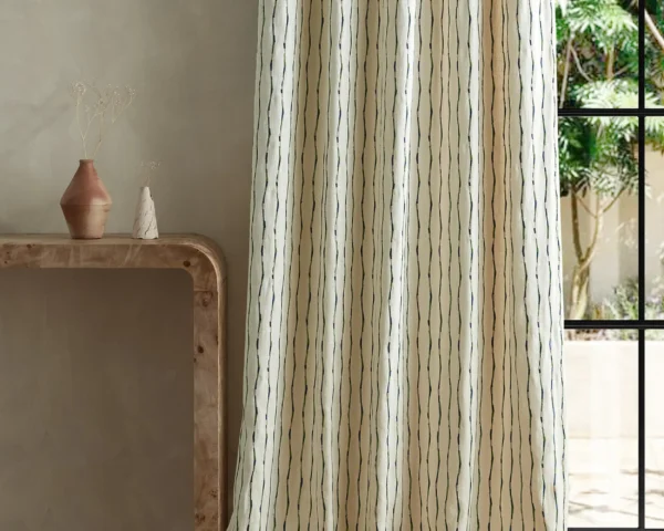 Morelia Fabric - Indigo / Malachite by green striped curtain with side table and vases