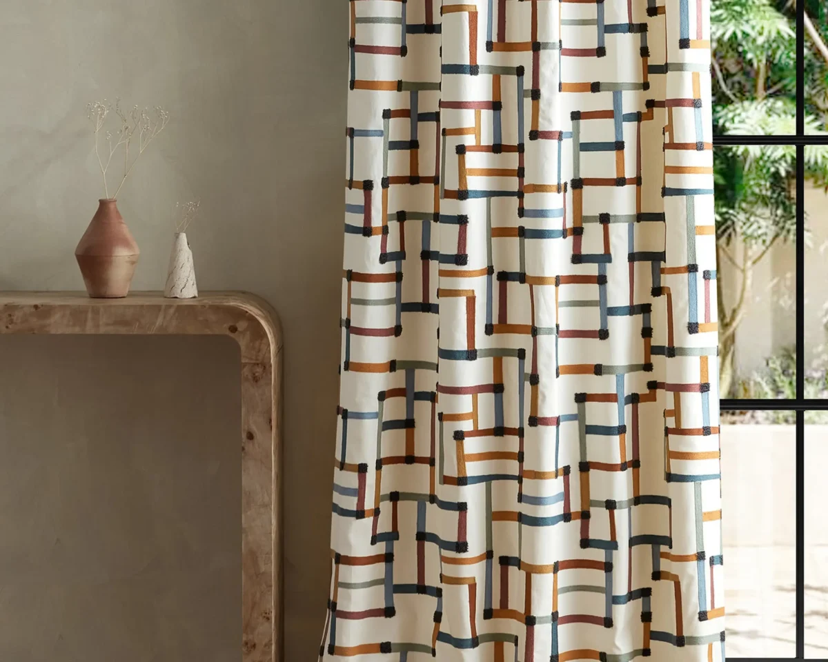 Lineas Fabric - Spice / Terracotta / Midnight by multicolour geometric curtain with side table and vases
