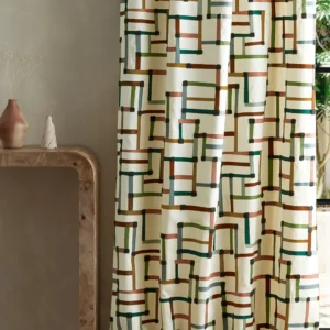 multicolour geometric curtain with side table and vases