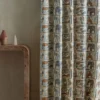 blue animal curtain with side table and vases