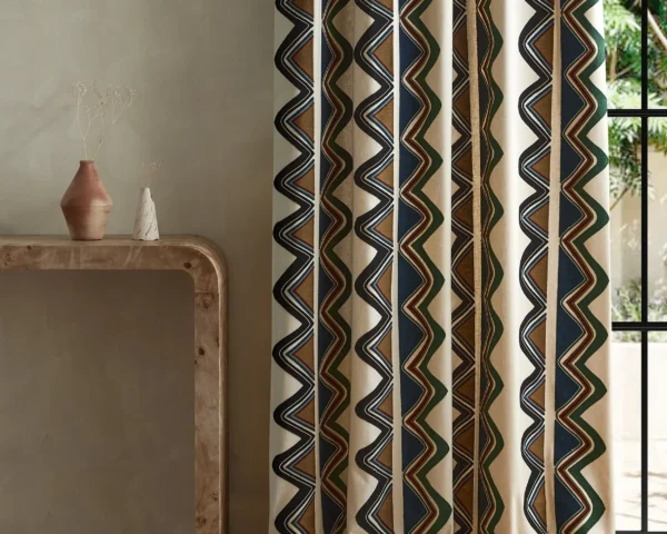 Kaleido Fabric - Moss / Onyx by blue striped curtain with side table and vases